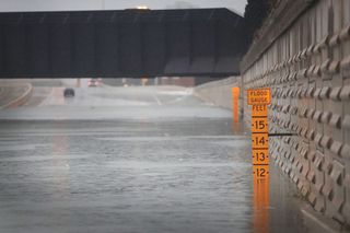 A gauge shows the depth of water at an underpass on Interstate 10 in Houston on Aug. 27, 2017. Houston has been inundated with flooding from Hurricane Harvey.