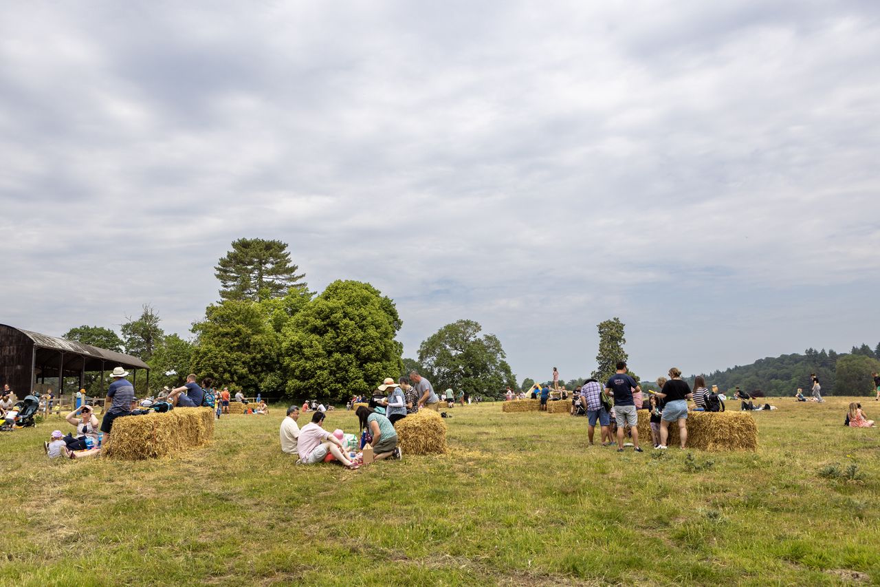visitors on hay bales