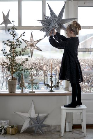 Christmas window decor hanging stars by Ella James