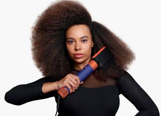 The Dyson Airwrap i.d. being used on afro hair