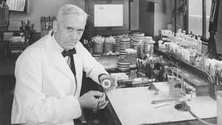 Alexander Fleming pictured in black and white in his laboratory