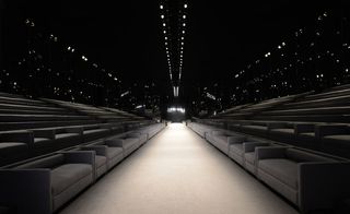 Squishy grey sofas, a spot-lit runway and mirrors everywhere