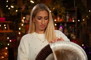 Stacey Solomon crafting a Christmas pudding wreath