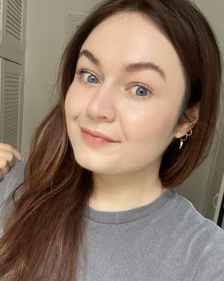 Lucy wearing Glossier Stretch Fluid Foundation in shade Very Light 4