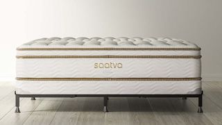 Saatva Mattress Foundation with the Saatva Classic Mattress on top, and a Saatva Universal Bed Frame on the bottom