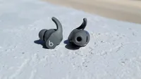 The Beats Fit Pro wireless earbuds shown outside of the charging