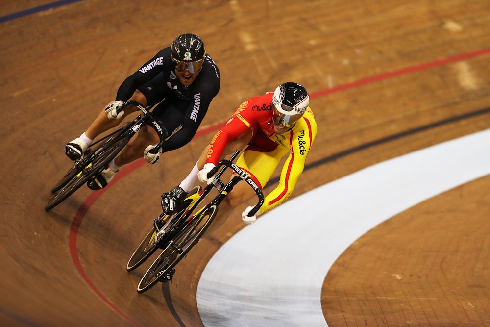 Simon van Velthooven of New Zealand and Juan Peralta Gascon of Spain compete in the first round of the Men's Sprint