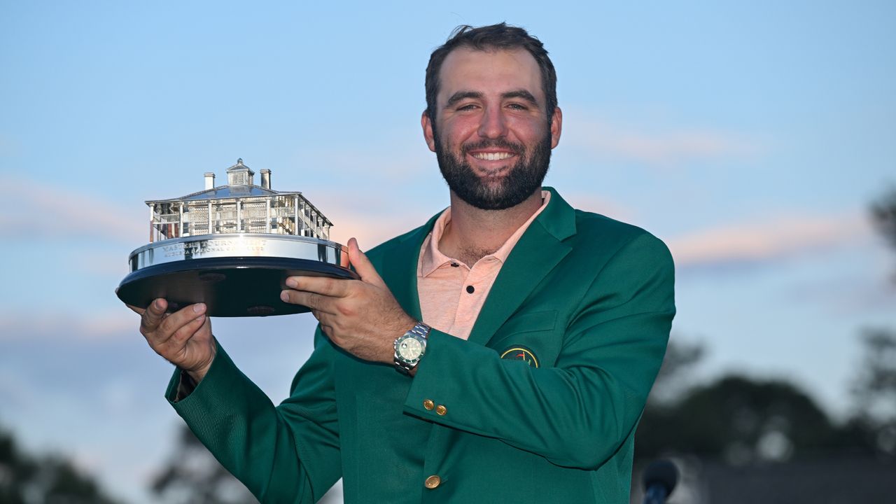 Scottie Scheffler with the trophy after winning The Masters