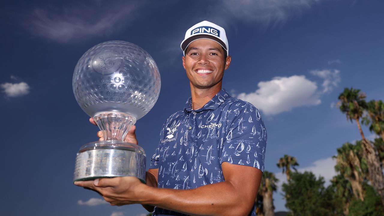 Johannes Veerman holds up the 2024 Nedbank Golf Challenge trophy