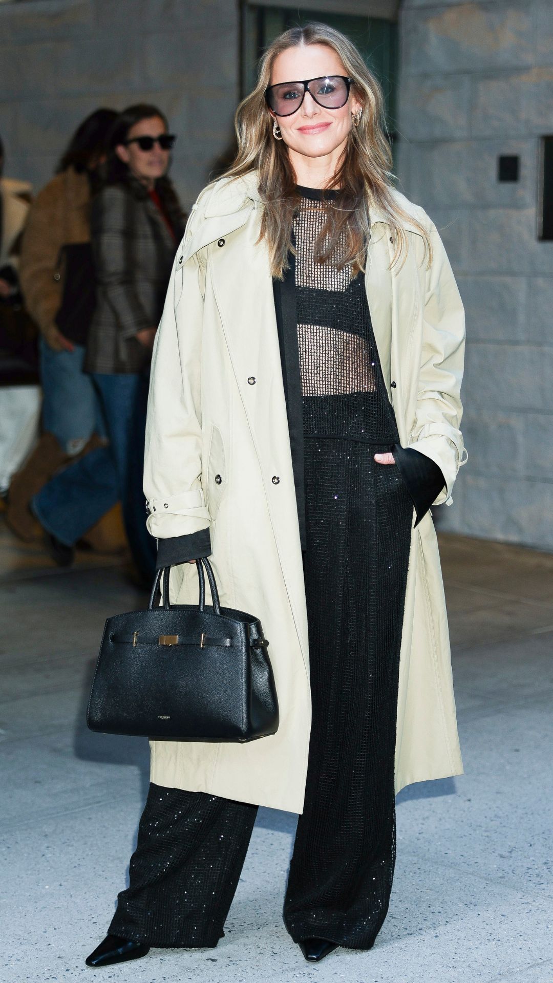 Kristen Bell wearing trench coat on October 23, 2025
