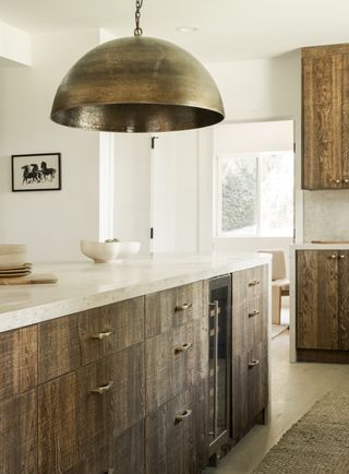 A neutral kitchen with dark cabinets