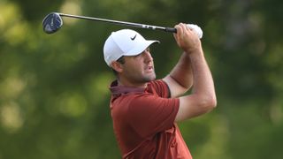 Scottie Scheffler hits an approach shot during the 10th hole of the PGA Championship