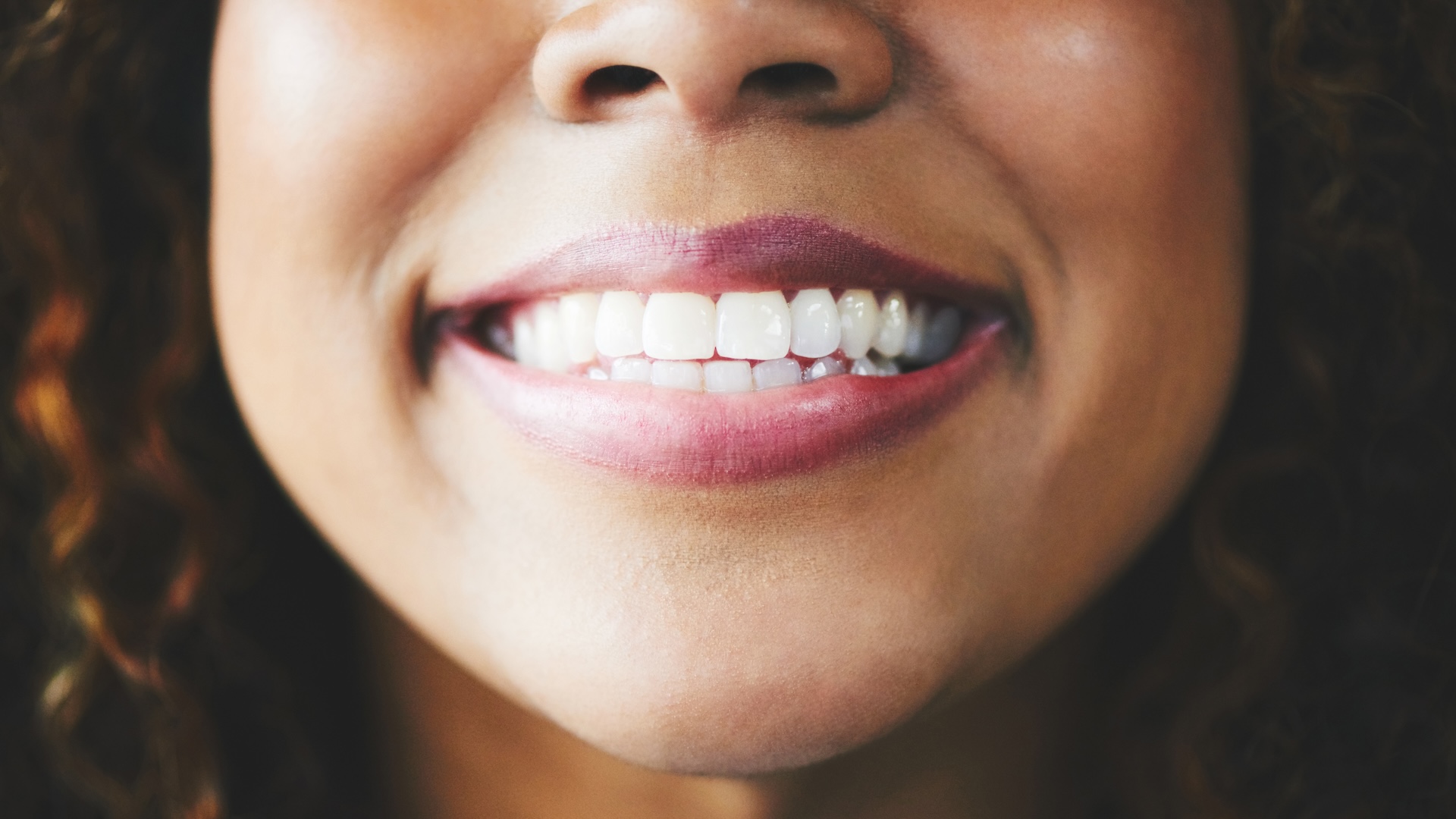 A close-up of a smiling woman