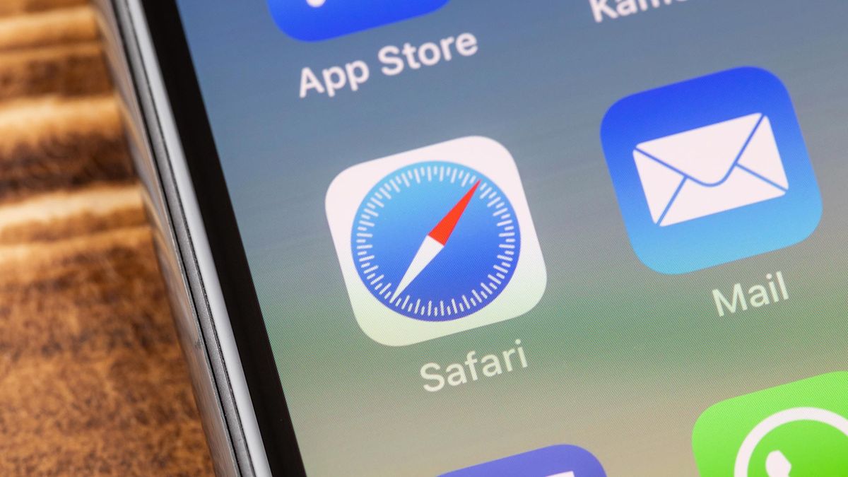 An image of an iPhone screen showing the Safari app icon in the center