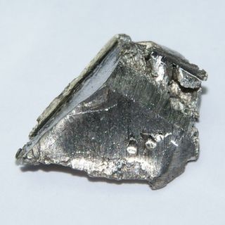 Two grams of ultrapure ytterbium, about 1 x 1.5 centimeters.
