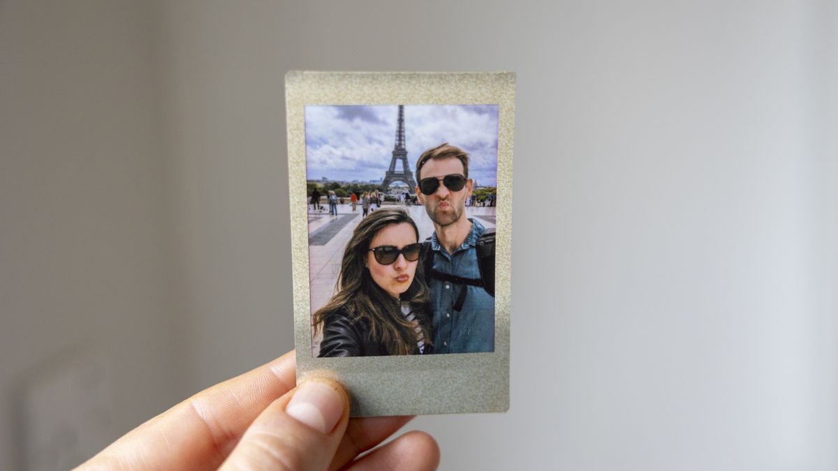 An Instax Mini featuring a couple in Paris