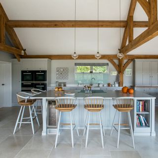 kitchen with white flooring and table and chair