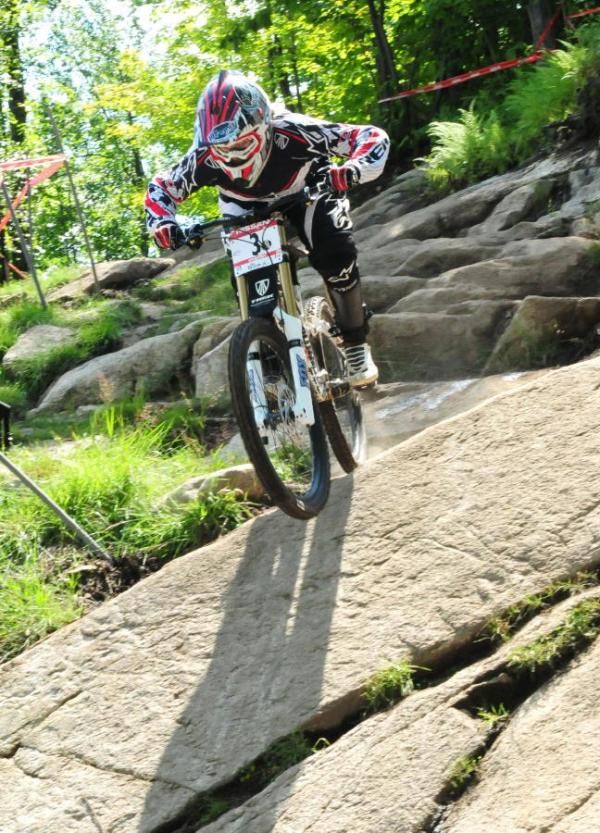 Tracy Mosley (Trek World Team) riding aggressively over the rocks.
