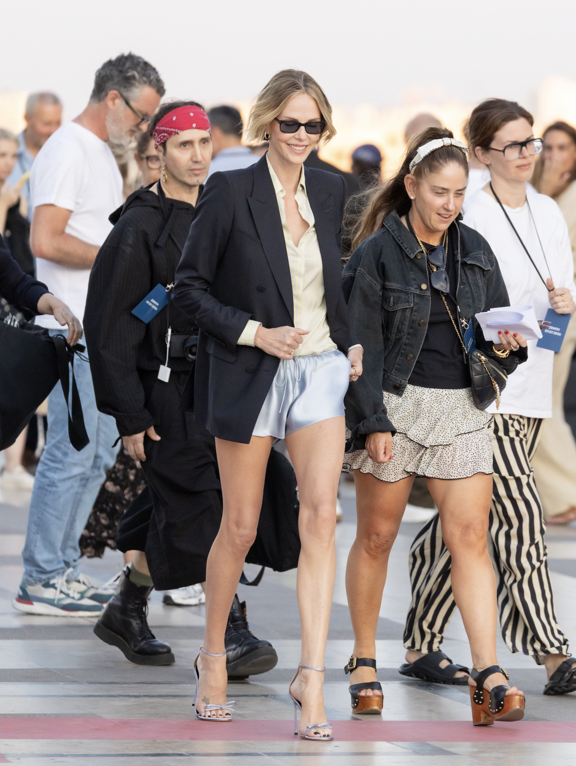 Charlize Theron wore silky shorts with a blazer on The Odyssey press tour