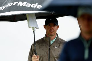 Rory McIlroy under an umbrella