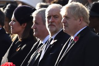 LONDON, ENGLAND - NOVEMBER 10:Britain's Prime Minister Boris Johnson (R) and Britain's Labour Party leader Jeremy Corbyn prepare to lay wreaths as they take part in the annual Remembrance Sun