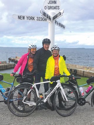 Martin Harvey at John O'Groats with his two daughters