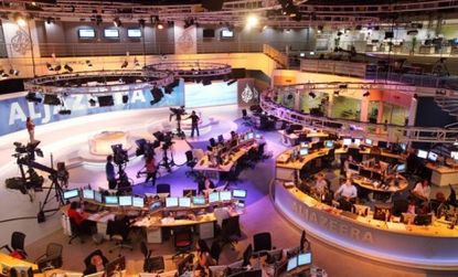 The bustling Al Jazeera newsroom: If a new computer program that creates news stories is any indication, journalism of the future may involve fewer human reporters and more software.