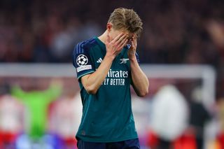 Arsenal star Martin Odegaard looks dejected after the UEFA Champions League quarter-final second leg match between FC Bayern München and Arsenal FC at Allianz Arena on April 17, 2024 in Munich, Germany.