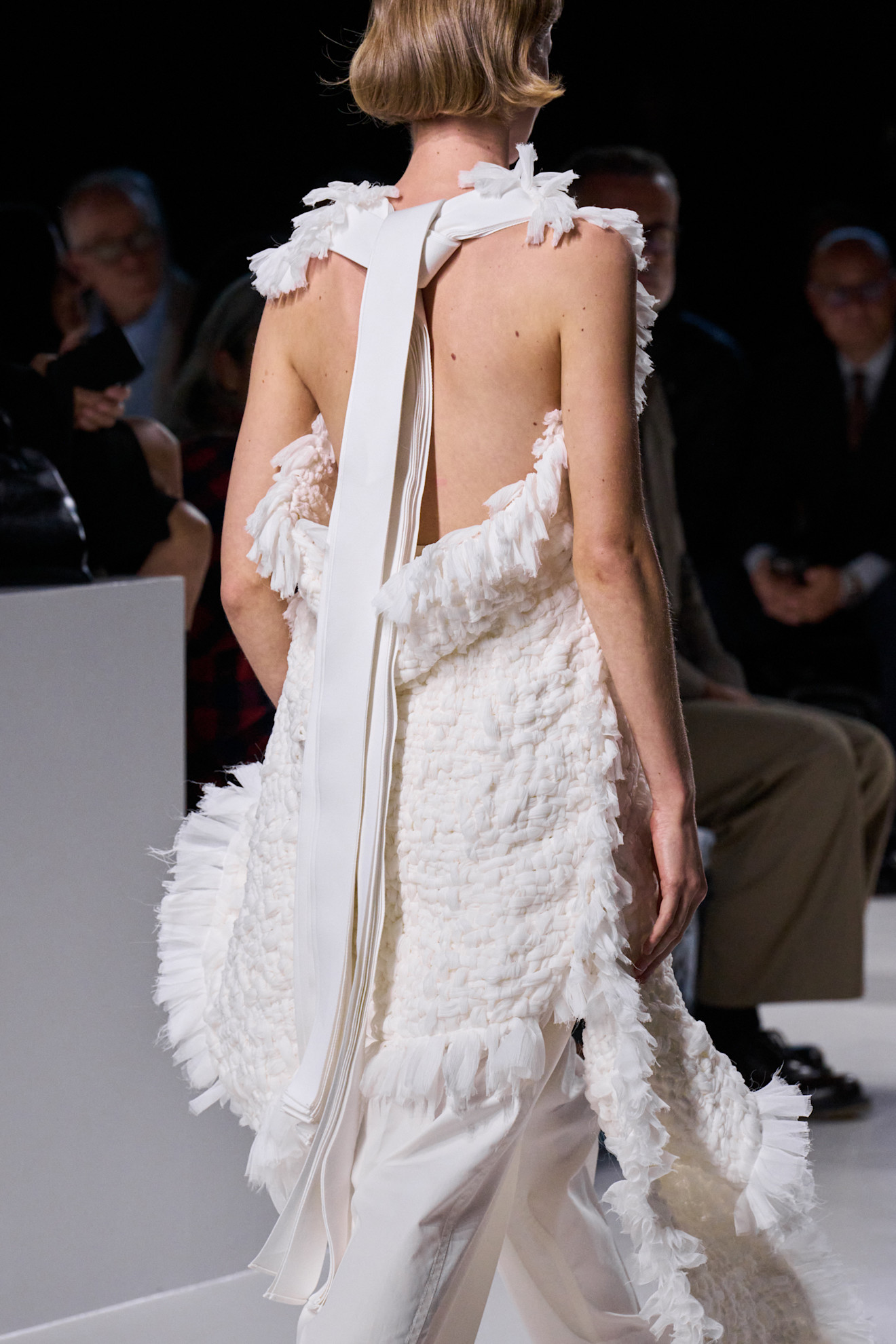 Close-up image of a white-on-white look from Bottega Veneta S/S 26.