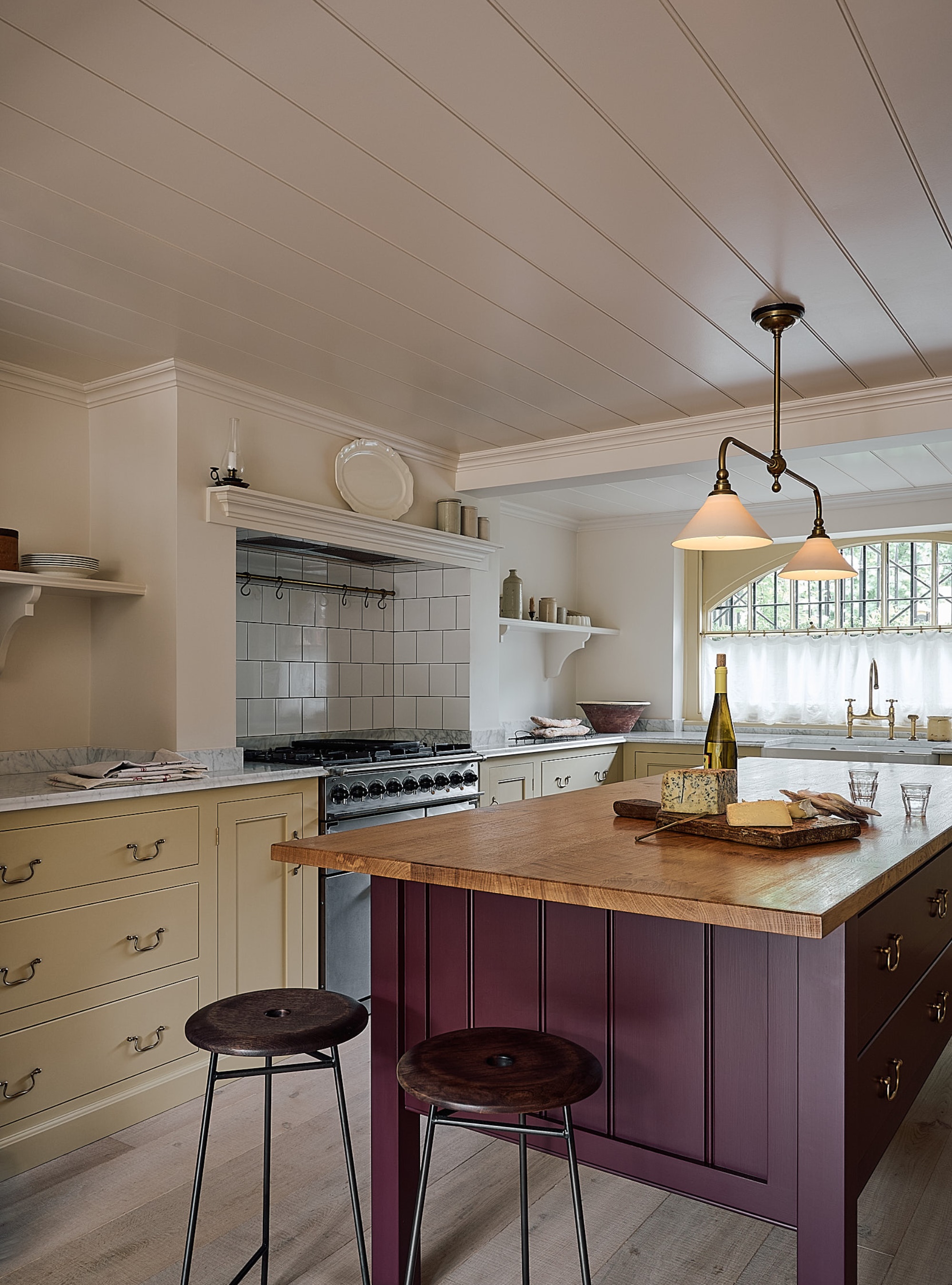 Yellow kitchen with burgundy kitchen island