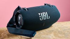 JBL Xtreme 4 on a granite table, on pink background