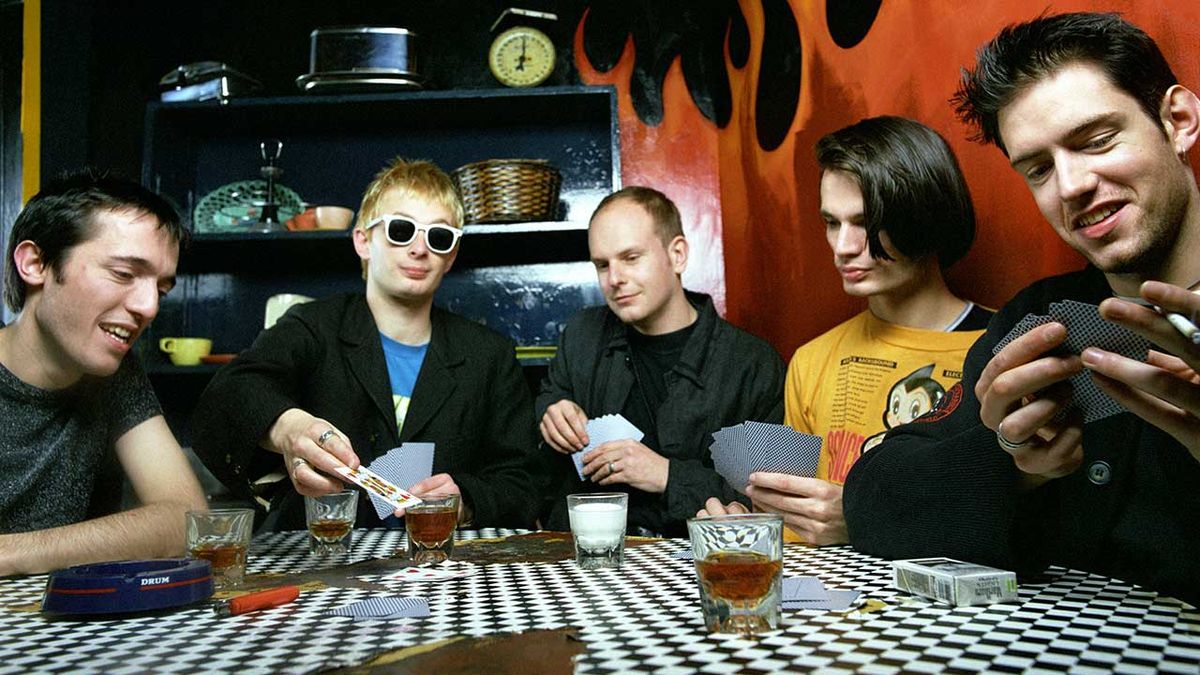 British rock group Radiohead play cards during a portrait session circa March, 1993 in New York