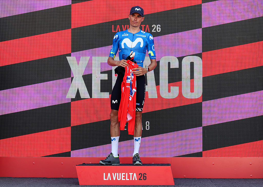 XERACO, SPAIN - AUGUST 29: Enric Mas of Spain and Movistar Team celebrates at podium as Red Leader Jersey winner without putting on a jersey as a sign of respect for the injured former leader Tadej Pogacar of Slovenia and UAE Team Emirates XRG, during the La Vuelta - 81st Tour of Spain 2026, Stage 8 a 171km stage from Pucol to Xeraco / #UCIWT / on August 29, 2026 in Xeraco, Spain. (Photo by Alexander Hassenstein/Getty Images)