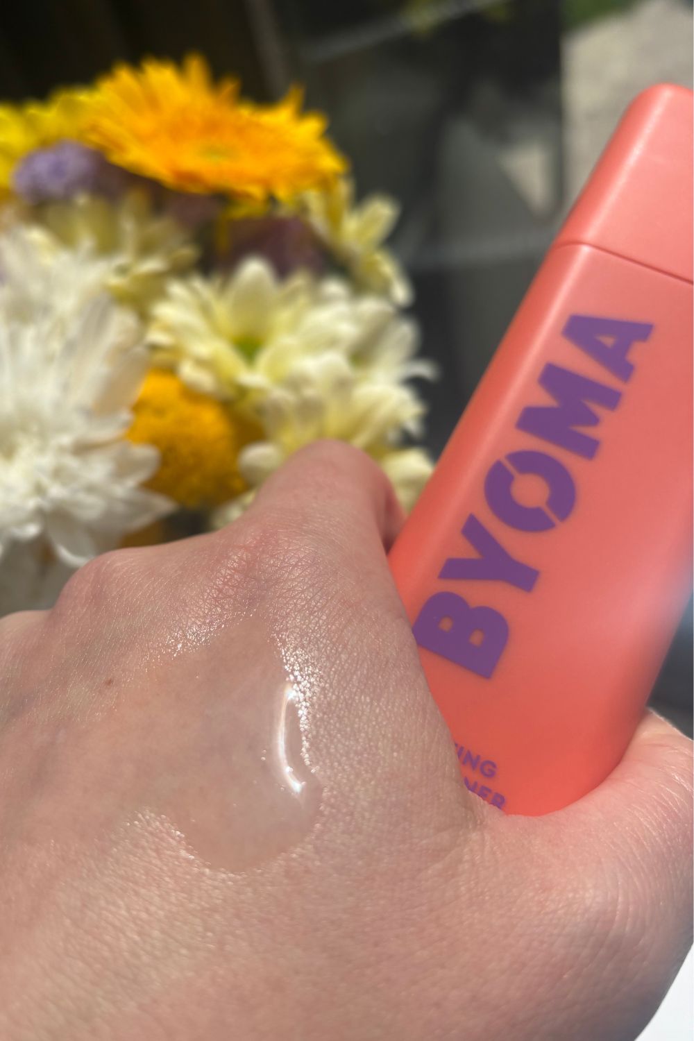 a hand holding byoma hydrating milky toner