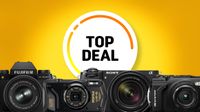Image features four cameras: Fujifilm X-S20, Pentax WG-8, Sony A6700, and OM System TG-7, with "Top Deal" text on a bright yellow background