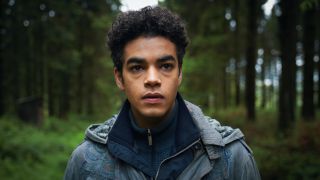 Will walks through a woodland searching for Lyra in His Dark Materials season 3