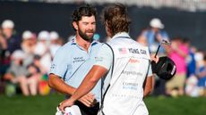 Cameron Young and his caddie celebrate winning The Players Championship