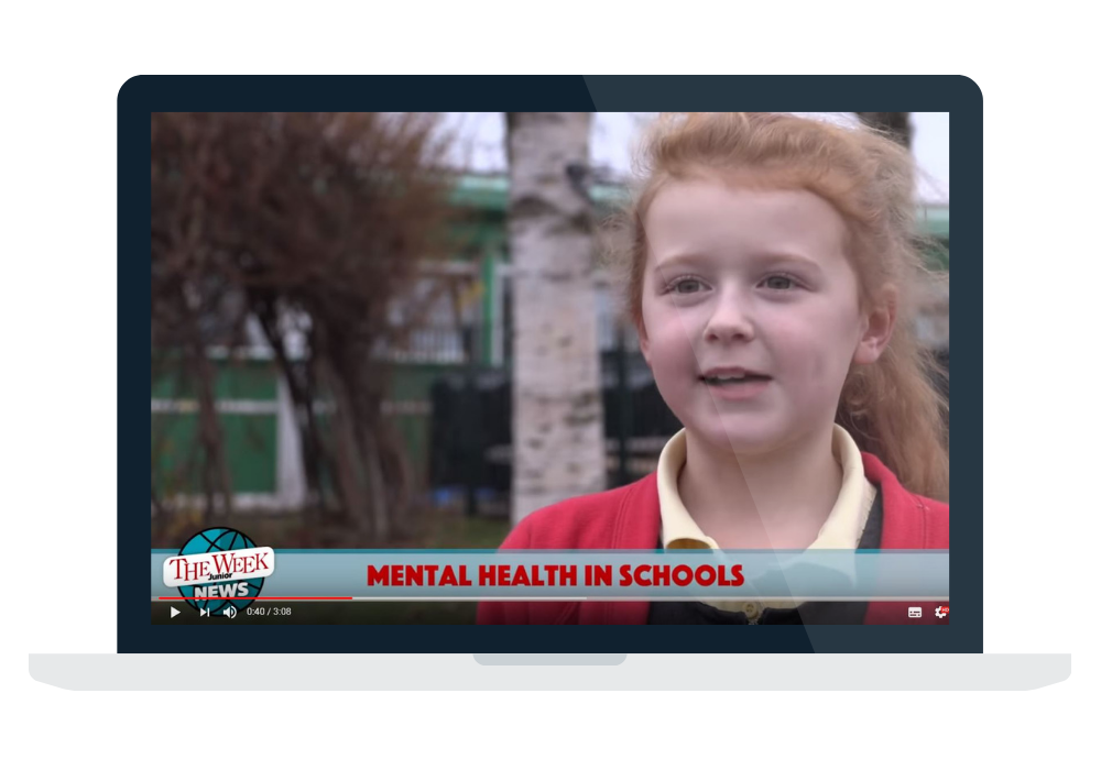 A young girl in school uniform talking on a laptop screen