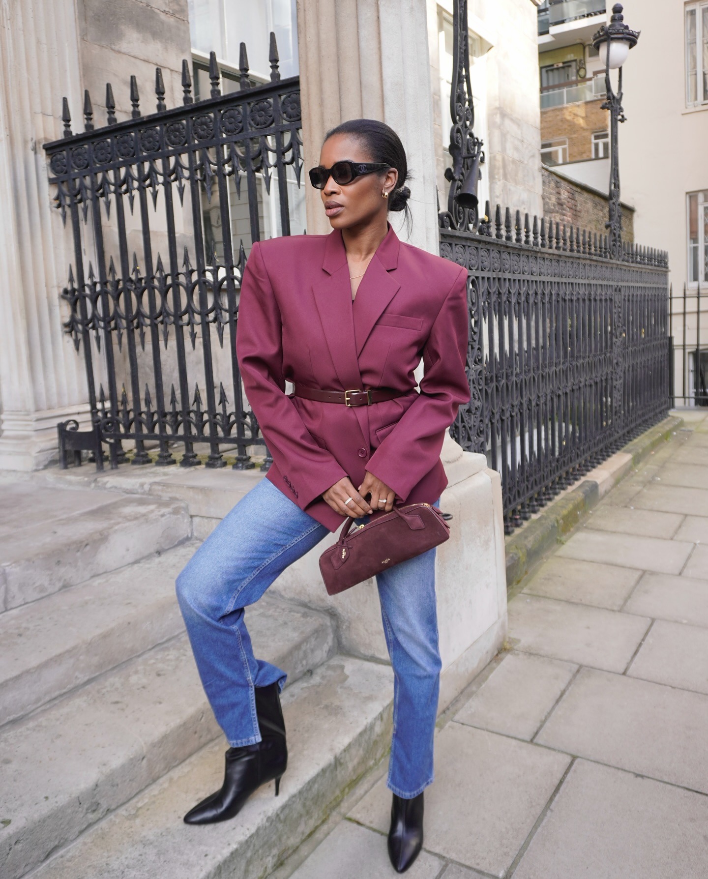 Woman wearing colorful handbag, a 2026 trend.