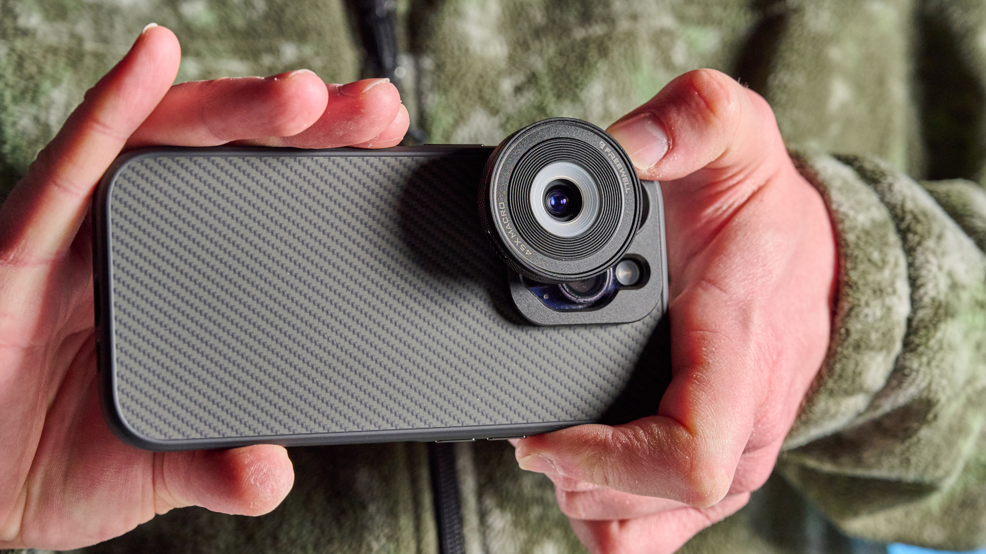 The Freewell iPhone lens 45x on a phone in hand