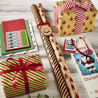 red and golden gift wrap gift boxes and christmas cards