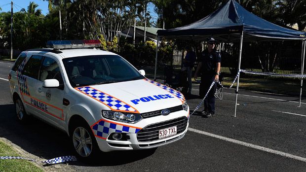 Police at the stabbing scene in the suburb of Manoora in Cairns, Australia.