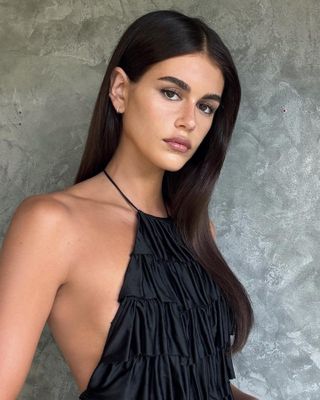 Kaia Gerber with charcoal brunette hair