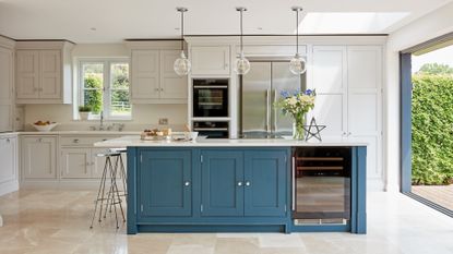 Kitchen designed by interior designer, Tom Howley with blue worktops and lights