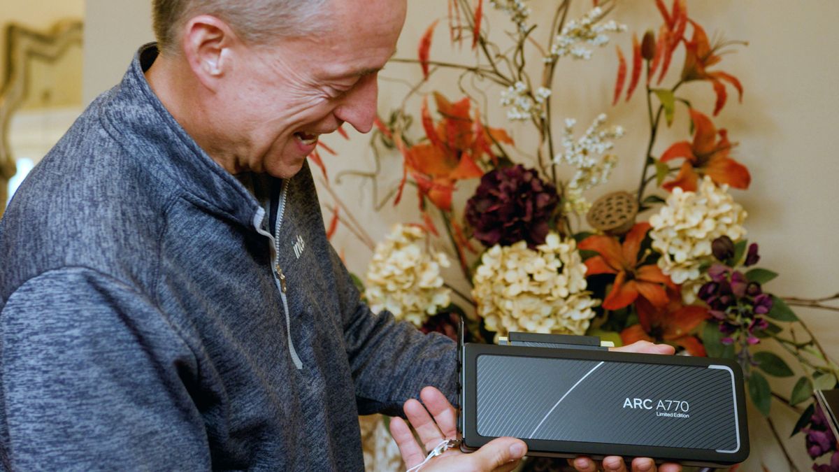 Pat Gelsinger holds an Intel Arc A770 graphics card.