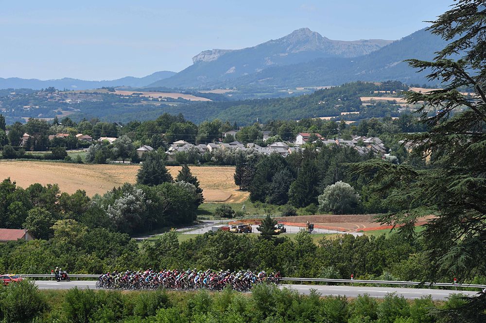 The peloton race stage 18 on the way to Saint-Jean-de-Maurienne