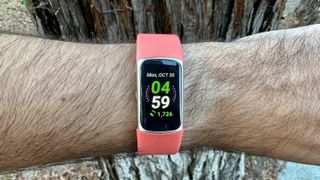 Close up of a custom watch face on the Fitbit Charge 6