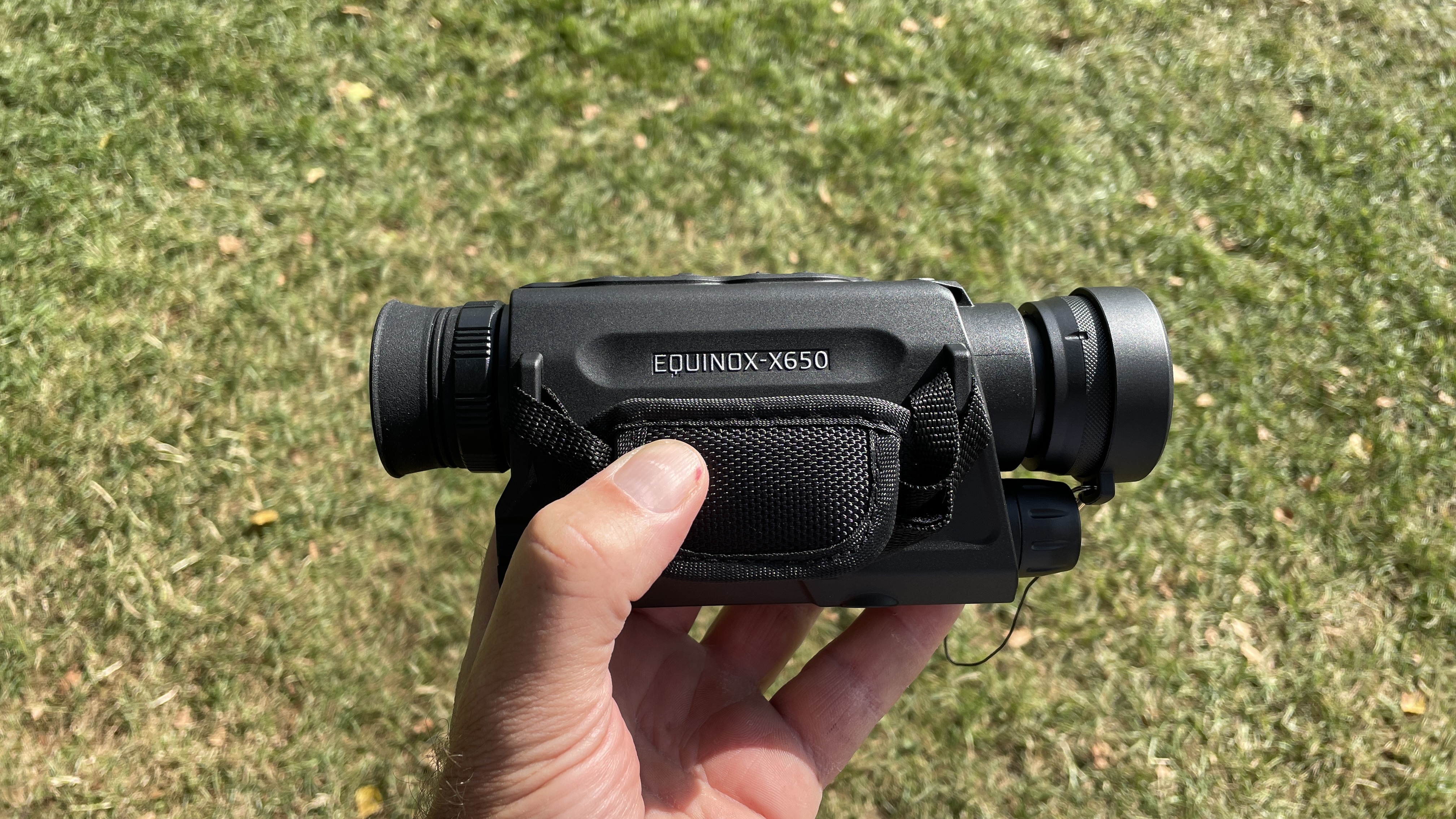 The side-view of the Equinox X650, held in a hand.