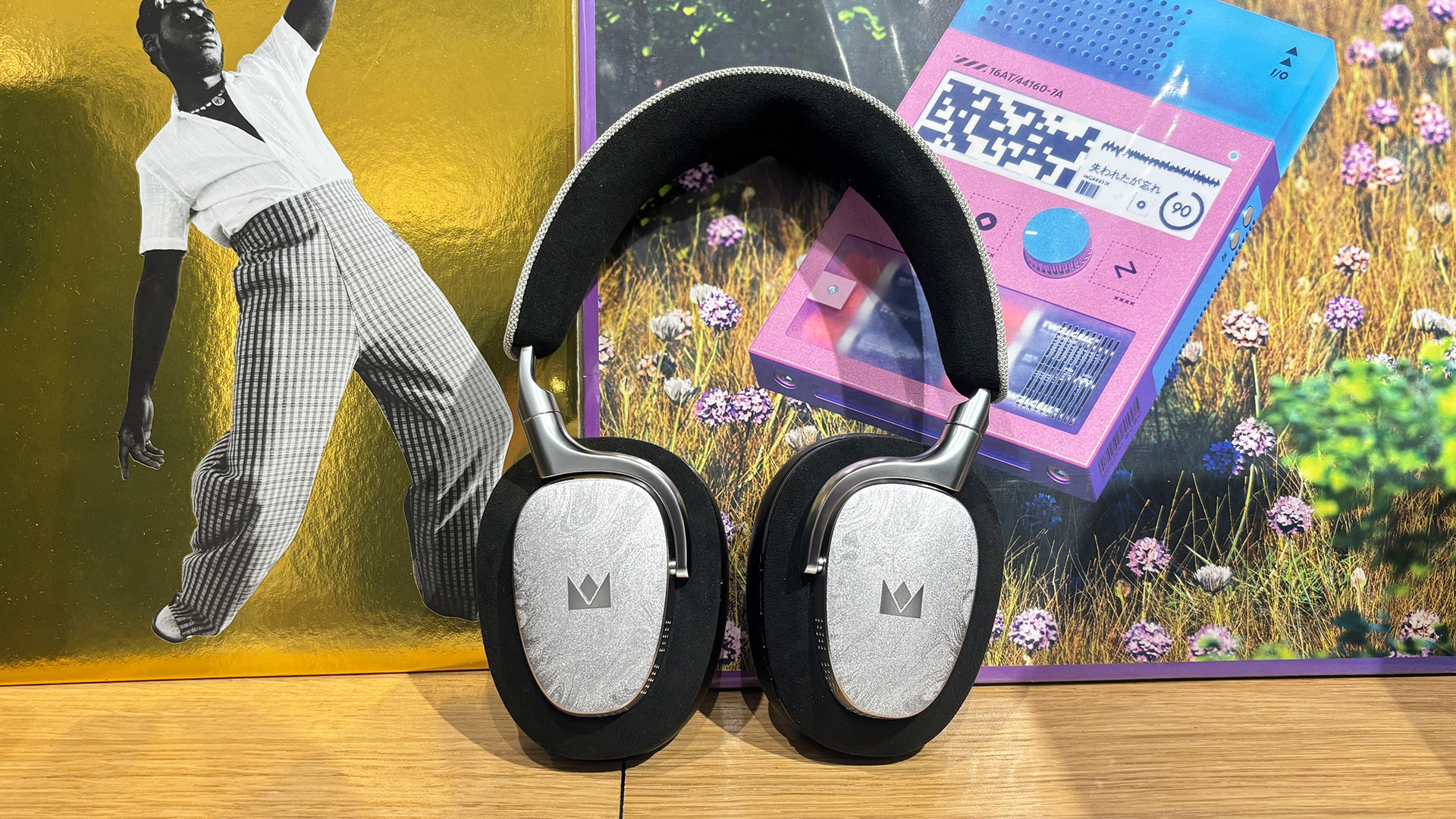 Noble Fokus Artemis over-ear headphones on busy bookcase