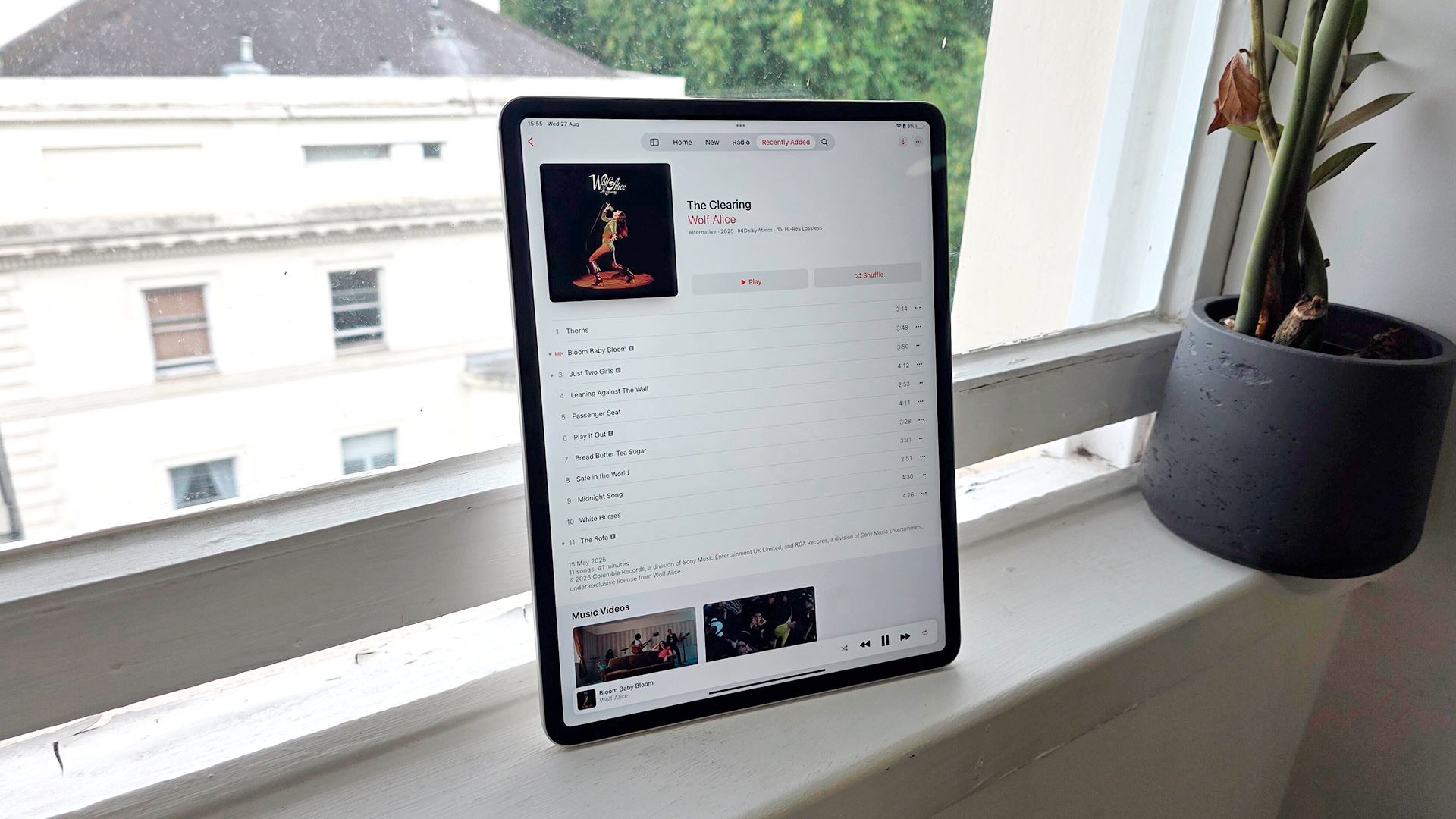 Apple iPad Air 13-inch (2025) tablet propped upright on window sill